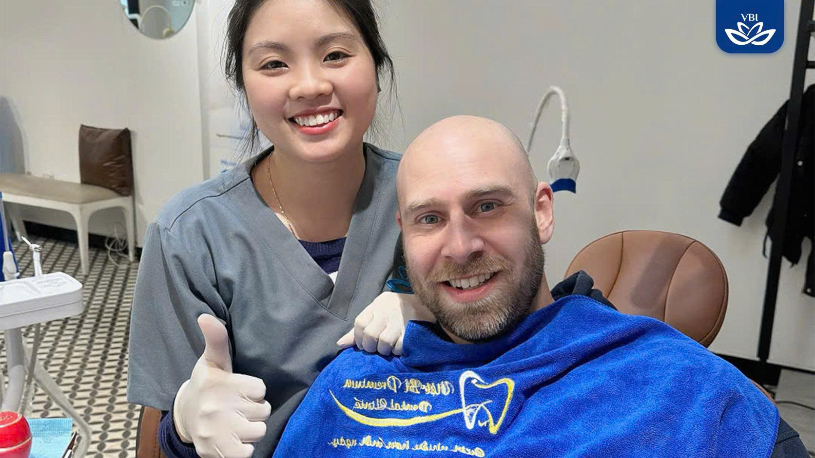 Patient smiling after immediate implant placement procedure